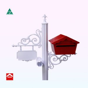 Chalet style letterbox rear open mounted on a scrolled bracket to the right of a 85mm fluted central post with fleur de lys on top. To the left is a newspaper holder and scrolled shingle for the number plate.