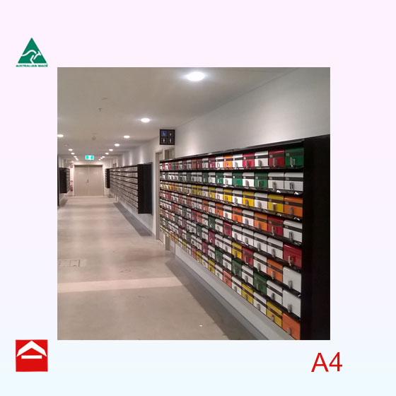 Bank of front open rectangular letterboxes. Surface mounted with different coloured doors