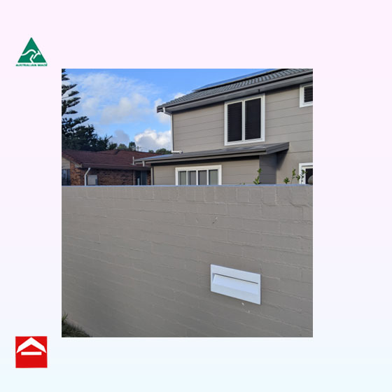 Rectangular Brick-in Plate 370Wx190H. Powder coated front plate installed in concrete wall.