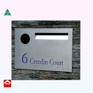 Stainless steel front plate with laser cutting and mail slot and paper holder with rear open aluminium letterbox behind