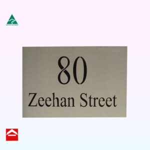 Stainless steel sign laser cut with black backing sheet